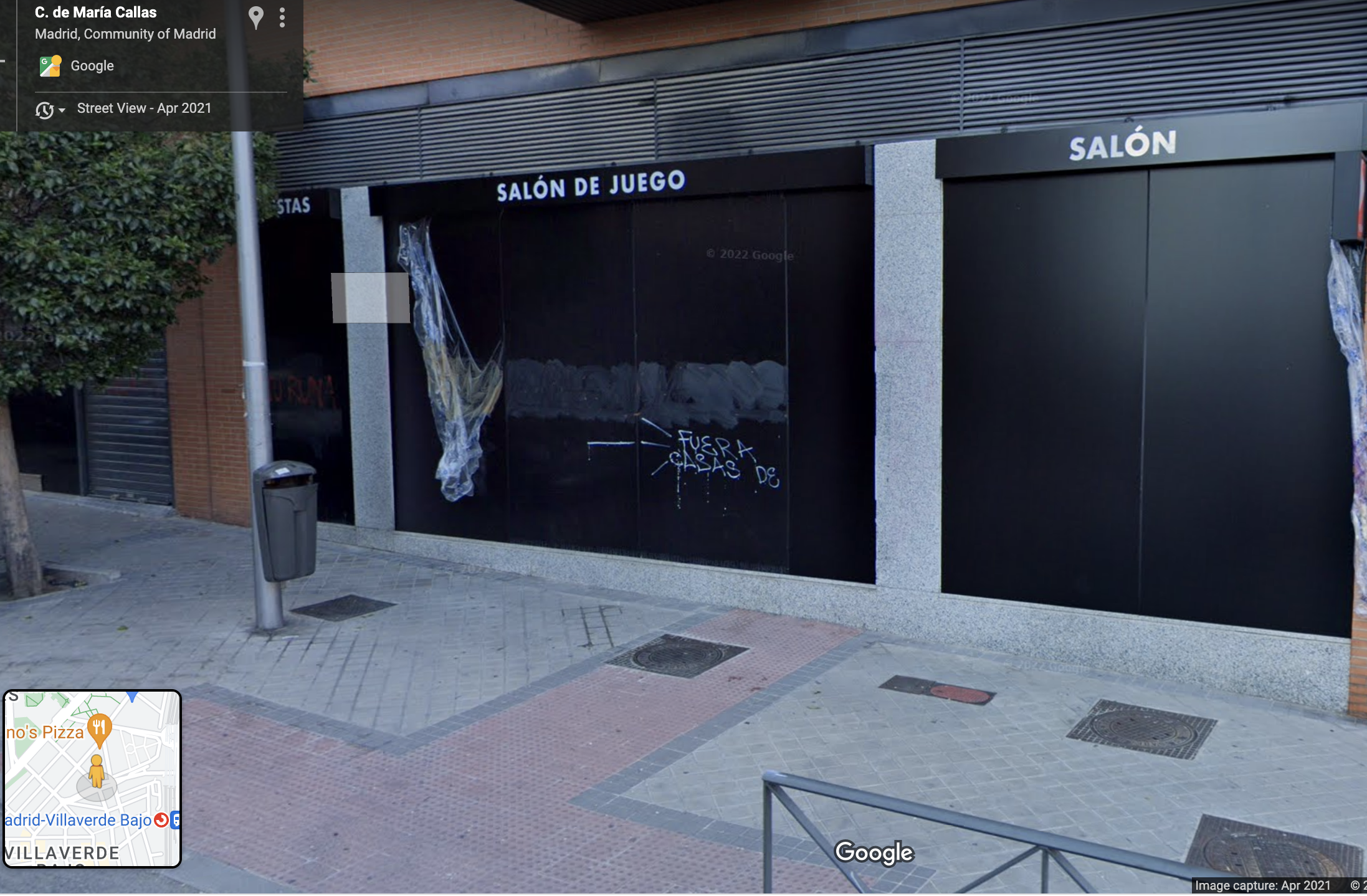 A gambling house with a graffiti that says: 'Betting shops out'